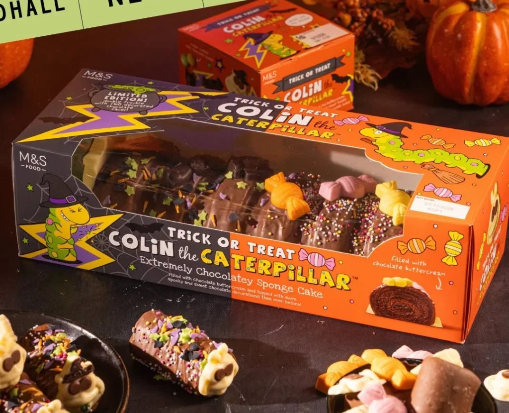 M&S launches Halloween Colin the Caterpillar with faces at both ends - spooky side features black cats and cauldrons. Limited-edition treat arrives in stores.