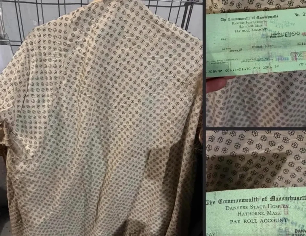 Pale patterned hospital patient gown with small geometric design laid across metal cage