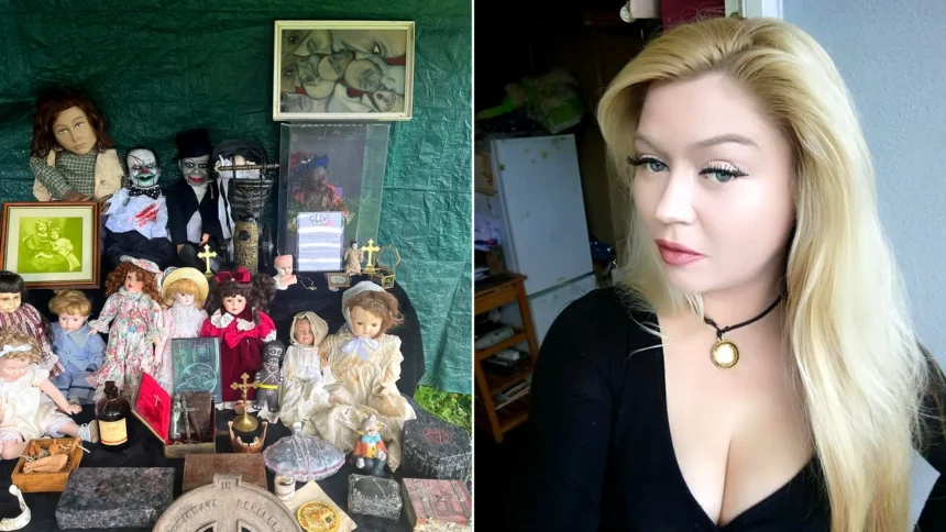 Blonde woman in black beside collection of antique dolls and paranormal objects on display